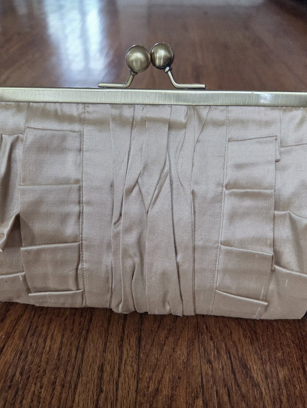 Elegant Pleated Satin Clutch in Champagne